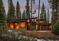 a house in the woods surrounded by trees