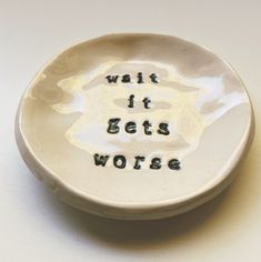 a white bowl with the words walk it gets worse written on it in black ink