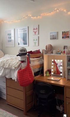 a bed room with a neatly made bed next to a desk and shelves on the wall