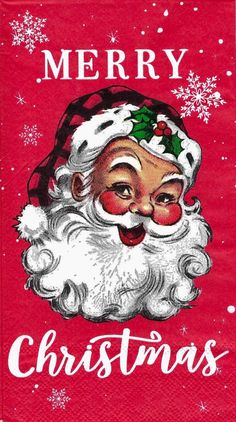 a red christmas napkin with a santa claus face and snowflakes on the front