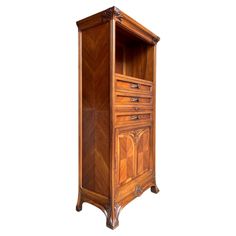 an old fashioned wooden cabinet with drawers