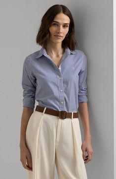 You'll look impeccable from the first coffee to the final conference of the day in a classic cotton shirt that you won't need to spend time ironing. 27 1/2" length (size Medium) Front button closure Point collar Long sleeves with button cuffs Curved hem 100% cotton Machine wash, line dry Imported Ralph Lauren Denim Shirt Women, Luxury Striped Dress Shirt With Spread Collar, Lauren Ralph Lauren Floral Crepe Blouse Blue, Coastal Grandmother Ralph Lauren, Early Fall Fashion, Casual Blouse Designs, Drapey Pants, Double Breasted Cardigan, Blue Button Up Shirt