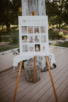 a sign that is sitting on top of a wooden easel with pictures in it