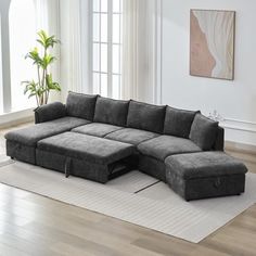 a living room with a sectional couch and rug