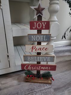 a christmas tree made out of wooden signs