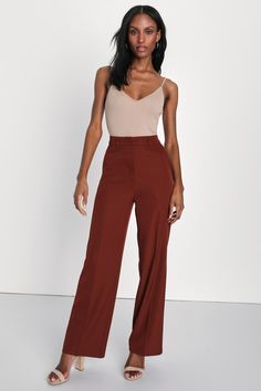 From work to happy hour, get down to business with the Lulus So Get This Rust Brown High-Waisted Wide-Leg Trouser Pants! Lightweight stretch-woven fabric shapes these pants with a high-rise waist, belt loops, and a hidden top clasp with a hidden zip fly. Two diagonal pockets accent wide pant legs that end at ankle-grazing hems. Fit: This garment fits true to size. Length: Ankle length. Size medium Inseam: 30.50 Front Rise: 13.00 Waist: Fitted - very fitted at natural waist. Hip: Loosely Fitted. Orange Bodysuit, Orange Pants, Lulu Fashion, Professional Attire, Interview Outfit, Brown Pants, Ankle Length Pants, Wide Pants, Bottom Clothes