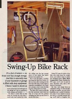 a man is fixing a bike on a rack in a garage with other tools and equipment