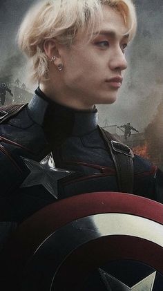 a young man with blonde hair wearing a captain america costume in front of a movie poster