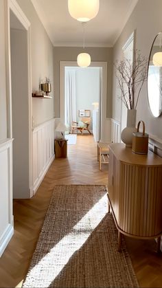 the hallway is clean and ready to be used as a living room or dining area