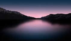 the night sky is lit up over a mountain lake