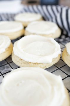 cookies with white frosting on a cooling rack