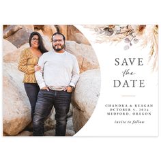 the save the date card features an image of two people standing next to each other