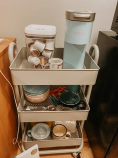 a kitchen cabinet filled with dishes and appliances