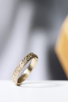 a wedding ring sitting on top of a table