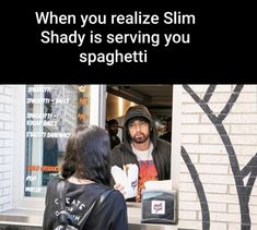 a man and woman standing in front of a store window with the caption when you reallize slim shady is serving you spaghetti