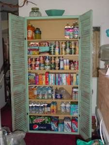 the pantry is stocked with all kinds of food