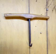 an old hammer is hanging on the wall