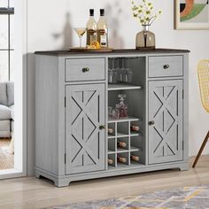 a grey cabinet with wine glasses and bottles on top