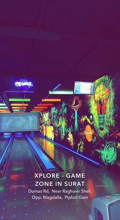 an image of a bowling alley with neon lights on the walls and in the lanes