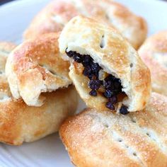 several small pastries on a white plate