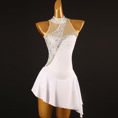 a woman's white leotard dress with sequins on the back