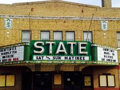 an old theater with the word state on it's marquee