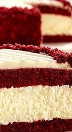 a slice of red velvet cake with white frosting