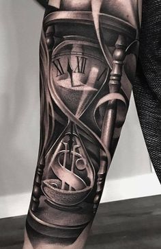 a man with a tattoo on his arm has an hourglass and money in it