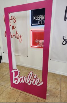 a pink frame with the word barbie on it