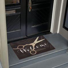 a door mat that says home with a dog on it