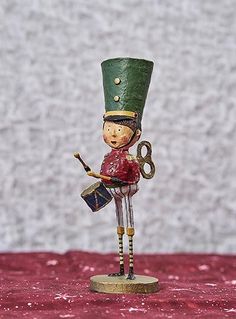 a toy soldier holding a bagpipe on top of a table