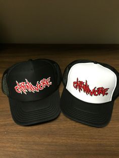 two hats sitting on top of a wooden table