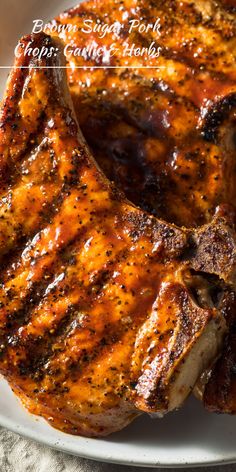 grilled pork chops on a white plate