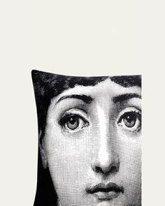 a black and white photo of a woman's face on a pillow cover with the image of an individual