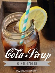 a mason jar filled with soda and topped with a lemon slice