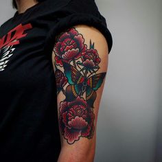 a person with a tattoo on their arm