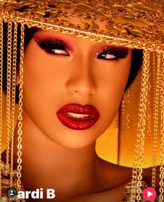 an image of a woman with gold jewelry on her head and red lipstick in the background