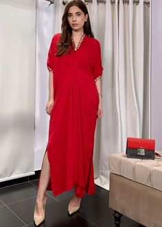 Crimson red georgette silk kaftan with details on the neckline, sleeves and back Elegant Red V-neck Kaftan, Red V-neck Kaftan For Party, Elegant Red Kaftan, Elegant Red Kaftan For Evening, Silk V-neck Kaftan For Formal Occasions, Silk V-neck Evening Kaftan, Red V-neck Rayon Maxi Dress, Red Silk Long Kaftan, Elegant Red Kaftan With Kimono Sleeves