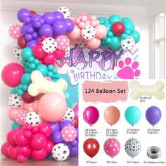 the balloon arch is decorated with balloons and dog bone decorations for a birthday or baby's first birthday