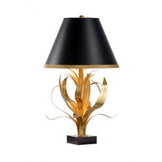 a table lamp with a black shade on the top and gold trimming around it