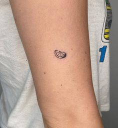 a person with a small tattoo on their arm