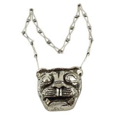 This impressive Guy Laroche Paris pendant necklace features an extra-long silvered metal textured chain with a massive dimensional pendant. The medallion boasts a lion face in silvered-metal-coated resin. There is an engraved signature on the pendant's edge. There is no closing clasp. The necklace is in good condition, with a few miss of metal coating on the edges. Measurements: Necklace total length is 27.13 in (69 cm) - Drop is 16.57 in long (42 cm) - medallion is 3.63 in high (9.2 cm) x 3.38 Metal Pendant Necklace, Art Nouveau Pendant, Metal Choker, Lion Pendant, Lion Face, Guy Laroche, Contemporary Pendant, Medallion Necklace, Lion Head