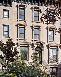 an apartment building with many windows and stairs