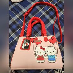 This Bag Comes With A Spacious Zipper Pocket Inside And A Mini Mirror As Shown In The Pictures Inside There Is Enough Space For 3 Water Bottles So It Can Carry Lots Of Stuff. New And Never Used Cute Hello Kitty Print Shoulder Bag, Cute Hello Kitty Print Bags, Cute Red Rectangular Satchel, Cute Red Shoulder Bag, Cute Red Shoulder Bag With Adjustable Strap, Cute Red Shoulder Bag With Zipper Closure, Hello Kitty Shoulder Bag For School, Cute Satchel With Adjustable Strap For Shopping, Cute Red Satchel Bag