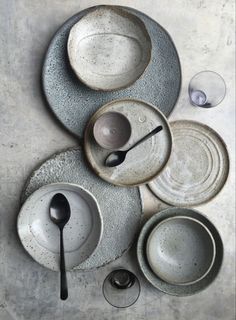 an assortment of dishes and utensils on a table