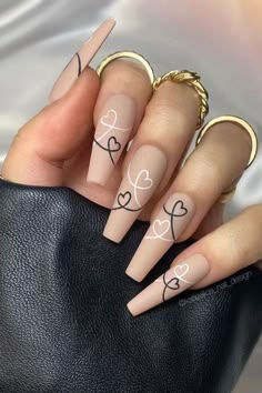 15 pretty and chic Valentine's nail ideas to try. We have rounded up lots of Valentine's Day nail ideas. From pink and red nails, to nails with heart designs we have you covered! Red nails, pink nails, heart nails, Valentines day nails, valentines day nails acrylic nail designs, nude nails, short trendy nails, pretty nails coffin, unique nail designs creative, chic nails, nails 2022, January nails, Febuary nails, nail ideas for valentines day, short valentines day nails. #valentinesnails Nails With Hearts, Romantic Nails, Cute Acrylic Nail Designs, Colorful Nails, Long Acrylic Nails Coffin, Orange Nails, Heart Nails, Short Acrylic Nails