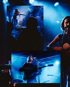 a woman singing into a microphone while holding a guitar in front of a man playing the keyboard