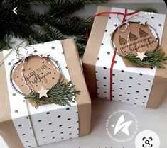 two gift boxes wrapped in brown and white paper