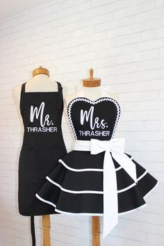 two aprons that say mr and mrs, one has a heart on the front