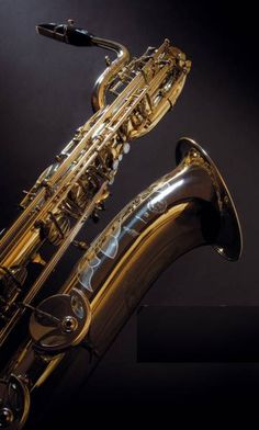 a saxophone is shown against a black background